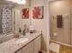 Bathroom with granite countertop, single sink, and shower/tub at 731 Lake Clark Ct, Lakeland, FL 33813