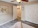 Bright bedroom with double bed, closet, and wood-look flooring at 731 Lake Clark Ct, Lakeland, FL 33813