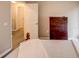 Guest bedroom with dresser and access to a shared bathroom at 731 Lake Clark Ct, Lakeland, FL 33813