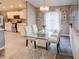 Elegant dining area with glass table and white cabinetry at 731 Lake Clark Ct, Lakeland, FL 33813