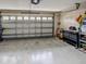 Attached garage with ample storage and workbench at 731 Lake Clark Ct, Lakeland, FL 33813
