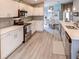 Modern kitchen with white cabinets and stainless steel appliances at 731 Lake Clark Ct, Lakeland, FL 33813