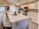 Modern kitchen with white cabinets, stainless steel appliances, and an island at 731 Lake Clark Ct, Lakeland, FL 33813