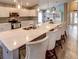 Spacious kitchen with island seating, stainless steel appliances, and white cabinetry at 731 Lake Clark Ct, Lakeland, FL 33813