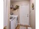 Convenient laundry room with washer, dryer, and extra storage at 731 Lake Clark Ct, Lakeland, FL 33813