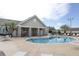 Community pool with lounge chairs and patio tables at 731 Lake Clark Ct, Lakeland, FL 33813