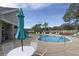 Community pool with lounge chairs and patio tables at 731 Lake Clark Ct, Lakeland, FL 33813