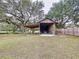 Rustic barn with covered storage area, ample space for equipment and vehicles at 7405 Havenwood Dr, Lakeland, FL 33810