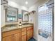 Bathroom with double sinks, granite countertops, and shower/tub combo at 7405 Havenwood Dr, Lakeland, FL 33810