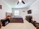 Bedroom with double bed, dresser, and TV at 7405 Havenwood Dr, Lakeland, FL 33810