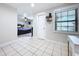 Bedroom with access to main bedroom and tiled floors at 7405 Havenwood Dr, Lakeland, FL 33810