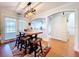 Charming dining area with wood table and access to the kitchen at 7405 Havenwood Dr, Lakeland, FL 33810