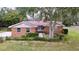 Brick ranch house with large yard and mature trees at 7405 Havenwood Dr, Lakeland, FL 33810