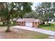 Brick ranch house with attached garage and large yard at 7405 Havenwood Dr, Lakeland, FL 33810