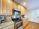 Kitchen with wood cabinets and stainless steel appliances at 7405 Havenwood Dr, Lakeland, FL 33810