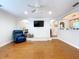 Relaxing living room with hardwood floors and a ceiling fan at 7405 Havenwood Dr, Lakeland, FL 33810