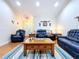 Spacious living room with ample seating and a wood coffee table at 7405 Havenwood Dr, Lakeland, FL 33810