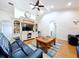Bright living room featuring hardwood floors, ample seating, and built-in shelving at 7405 Havenwood Dr, Lakeland, FL 33810