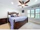 Main bedroom with large bed, ceiling fan, and window seat at 7405 Havenwood Dr, Lakeland, FL 33810