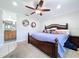 Main bedroom with king-size bed and ensuite bathroom access at 7405 Havenwood Dr, Lakeland, FL 33810