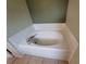 Oval bathtub with a white finish and a tiled surround at 8052 Sugar Pine Blvd, Lakeland, FL 33810