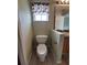 Clean bathroom with toilet and sink at 8052 Sugar Pine Blvd, Lakeland, FL 33810