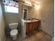 Bathroom with double sinks and toilet at 8052 Sugar Pine Blvd, Lakeland, FL 33810