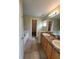 Double vanity bathroom with a separate tub and toilet at 8052 Sugar Pine Blvd, Lakeland, FL 33810