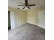 Spacious bedroom with ceiling fan and carpet at 8052 Sugar Pine Blvd, Lakeland, FL 33810