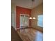 Bright dining area with hardwood floors and access to patio at 8052 Sugar Pine Blvd, Lakeland, FL 33810