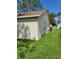 Side view of tan house exterior with brown roof at 8052 Sugar Pine Blvd, Lakeland, FL 33810