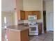Kitchen with wood cabinets and appliances at 8052 Sugar Pine Blvd, Lakeland, FL 33810