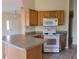 Efficient kitchen featuring wood cabinets and modern appliances at 8052 Sugar Pine Blvd, Lakeland, FL 33810