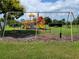Community playground with swings and playset at 8052 Sugar Pine Blvd, Lakeland, FL 33810