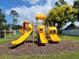 Modern playground with yellow slides and climbing features at 8052 Sugar Pine Blvd, Lakeland, FL 33810