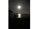 Tranquil lake view at night, illuminated by the moon at 809 Fairlane Dr, Lakeland, FL 33809
