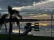 Scenic sunrise view over calm lake waters at 809 Fairlane Dr, Lakeland, FL 33809