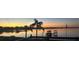 Stunning sunset view over the lake from a waterfront home at 809 Fairlane Dr, Lakeland, FL 33809