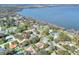 Aerial view of the house and surrounding neighborhood by the lake at 1118 Cypress W Pt, Winter Haven, FL 33884