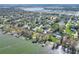 Aerial view of home near lake and residential neighborhood at 1118 Cypress W Pt, Winter Haven, FL 33884