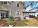 Backyard with patio, fire pit, and landscaping at 1118 Cypress W Pt, Winter Haven, FL 33884