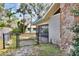 View of backyard with a black chain link fence and gate at 1118 Cypress W Pt, Winter Haven, FL 33884