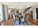 Spacious dining area with hardwood floors and view of staircase at 1118 Cypress W Pt, Winter Haven, FL 33884