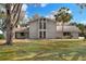 Two-story house with a large yard and palm trees at 1118 Cypress W Pt, Winter Haven, FL 33884