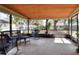 Relaxing screened porch with rocking chairs and patio furniture at 1118 Cypress W Pt, Winter Haven, FL 33884