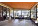 Screened porch with rocking chairs and wood ceiling at 1118 Cypress W Pt, Winter Haven, FL 33884