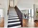 View of a modern staircase leading to the upper level of the home at 1118 Cypress W Pt, Winter Haven, FL 33884