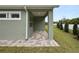 Covered patio with paver stones and view of backyard at 161 Laynewade Rd, Polk City, FL 33868