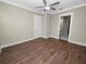 Spacious bedroom with wood-look flooring and an ensuite bathroom at 161 Laynewade Rd, Polk City, FL 33868