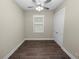 Spacious bedroom with wood floors and ceiling fan at 161 Laynewade Rd, Polk City, FL 33868